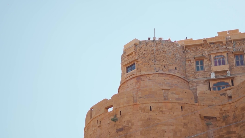 Closeup shot of the fort wall with buildings at Jaisalmer Fort in Jaisalmer, Rajasthan, India. Houses inside the fort wall. Fort in the desert of Jaisalmer.