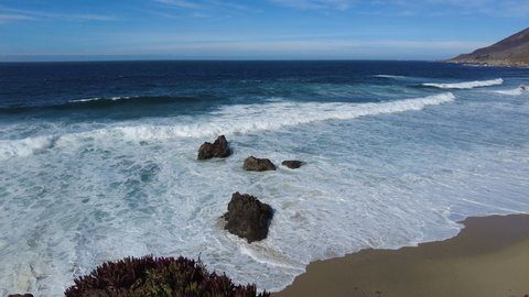 The Pacific Ocean washes against the beautiful coast of California just north of Big Sur. The Pacific Coast Highway, or PCH, runs over 600 miles along the edge of this scenic state.