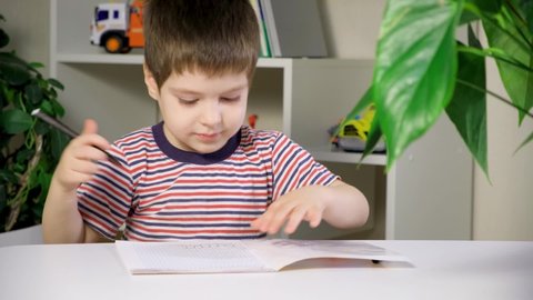 Preschool child learns to write, writes copybook. Preschool child learns to write, writes copybook.