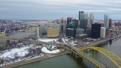 Pittsburgh , Pennsylvania , United States - 03 13 2022: Aerial View of Iconic Pittsburgh Skyline downtown on a cloudy evening during winter