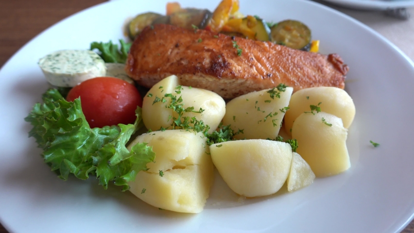 Salmon with potatoes on a plate