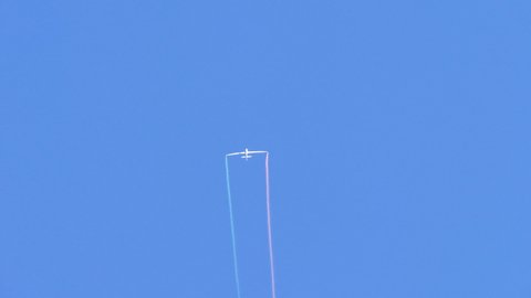 Thiene Italy OCTOBER, 16, 2021 Swift S1 extreme acrobatics maneuvers by Luca Bertossio against the clear blue sky. Smoke coming out of the vehicle. Stunt flying for an air show. Loops maneuvers. 
