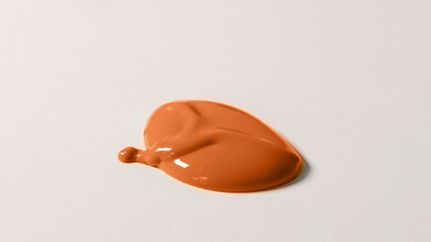 Blob Of Orange Paint Falls Closeup