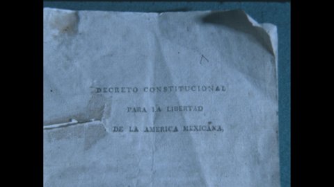 1960s: Paper reads "DECRETO CONSTITUCIONAL PARA LA LIBERTAD DE LA AMÉRICA MEXICANA." Portrait of man.