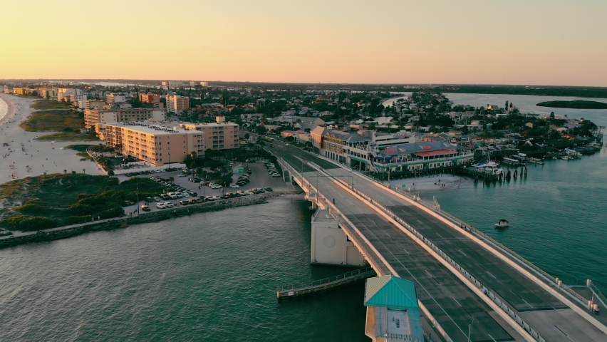 Johns Pass Madeira Beach AERIAL. Strait and waterfront that is south Florida in St. Petersburg. Strait and drawbridge at sunset.