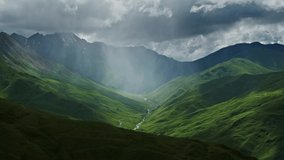 Beautiful mountain landscape with rain clouds and sun rays in canyon, 4k - Powered by Shutterstock - Get 15% off with code: PIKWIZARD15