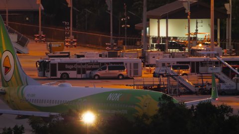 PHUKET, THAILAND - NOVEMBER 26, 2019: Boeing 737, HS-DBR of Nok Air on the runway at Phuket airport (HKT). Airplane in line for departure, night time