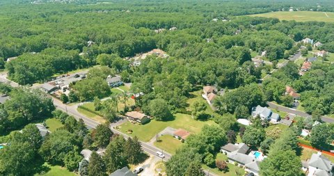 Wide top panorama, aerial view with beautiful residential quarters and green streets in Monroe New Jersey USA