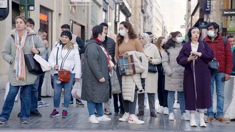 Brussels , Belgium - 03 20 2022: Multi racial people waiting downtown at crosswalk. Diverse multiethnic community concept