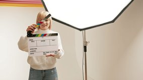 Smiling woman Hold Film Making Clapperboard. Copy Space For Text