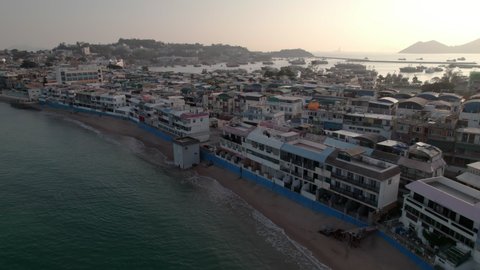 Aerial view of residential buildings in Cheung Chow Island at sunset. Residential buildings with seascape in Hong Kong.