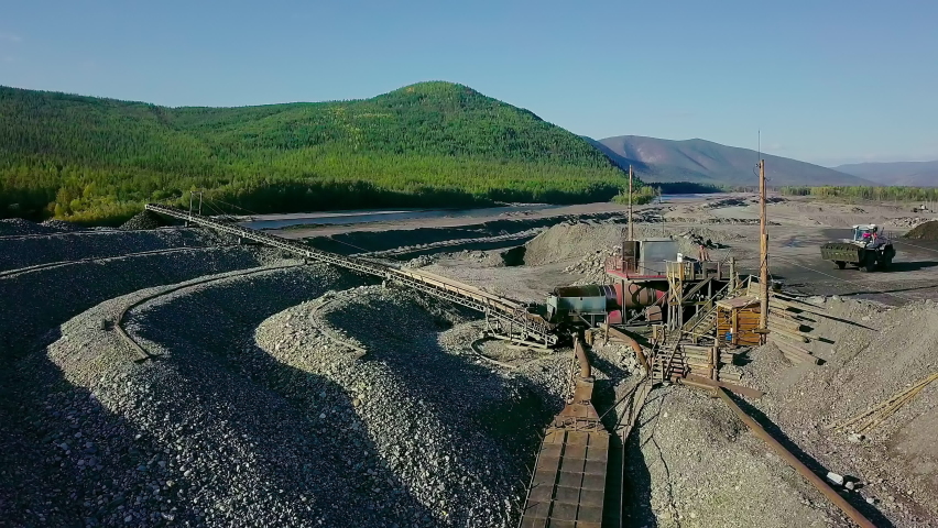 Automated Conveyor Belt Equipment Transports Rocks At A Mining Site. Advanced Industrial Conveyor Line Mining Equipment. Conveyor Equipment Washes Natural Resources At A Mine Quarry. Machinery Royalty-Free Stock Footage #1088564291