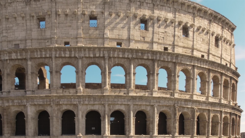 Tilt-up close-up of The Colosseum famous historical landmark in Rome, Italy.