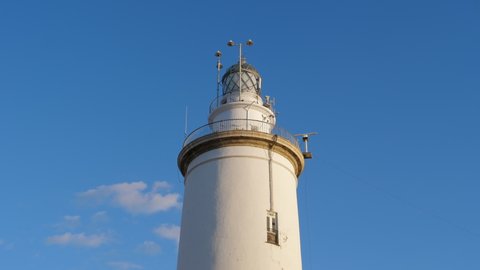 Lighthouse of Malaga in Spain with a Weather Radar monitoring on a Sunny day, Still, Medium shot