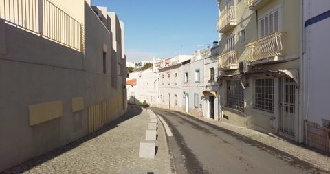 Walking along the empty street of Algarve tourism destination. Traveling the world. Coronavirus pandemic concept. Usually busy street no empty due to coronavirus outbreak. Quarantine