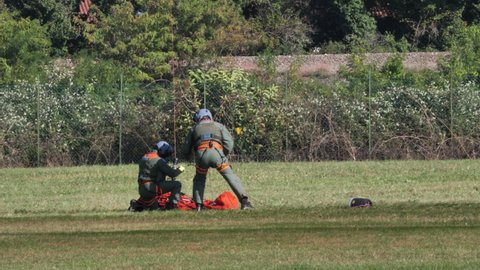 Thiene Italy OCTOBER, 16, 2021 Two rescuers hook the stretcher with the injured person to the winch of a military ambulance helicopter. AgustaWestland AW139 Leonardo of Italian Air Force