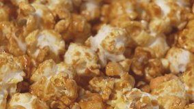 4K slow motion 100fps frame rate shutter speed clips of Rotating popcorn background. Selective focus