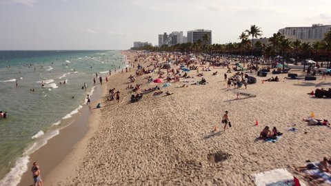 Fort Lauderdale, FL, USA - March 20, 2022: College students on vacation Fort Lauderdale beach Spring Break FL 4k aerial video