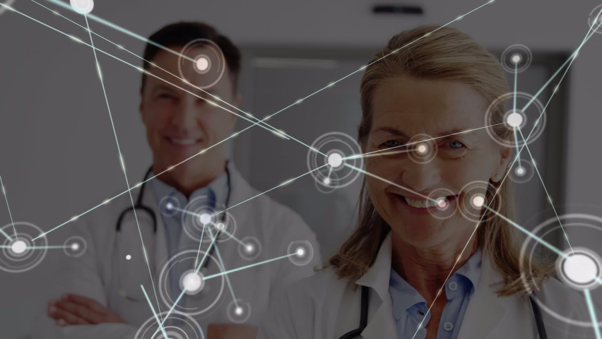 Animation of network of connections over caucasian doctors. global medecine, healthcare and connections concept digitally generated video.