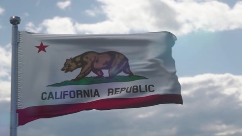 California flag on a flagpole waving in the wind in the sky. State of California in The United States of America