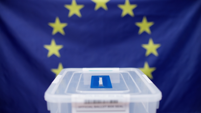 European voter throwing ballot into the sealed box, elections in European Union Royalty-Free Stock Footage #1088588525