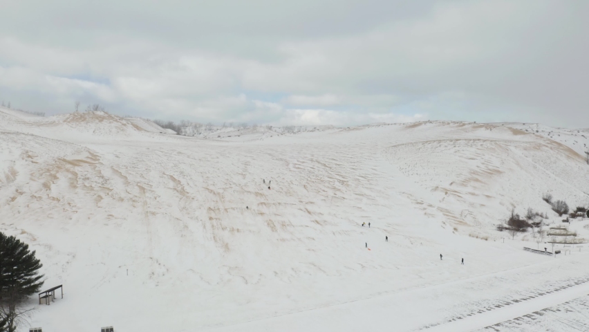 Aerial View of People Sledding at Sleeping Bear Dunes National Lakeshore, Michigan. Winter