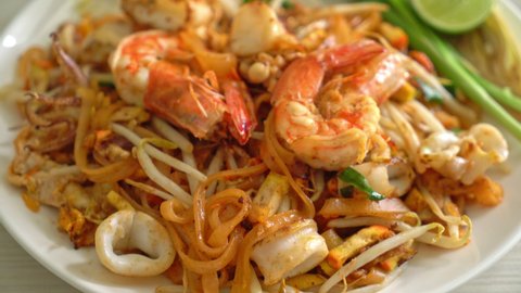 Pad Thai Seafood - Stir fried noodles with shrimps, squid or octopus and tofu in Thai style