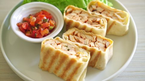 Mexican Quesadilla Chicken - Tortilla wrapped chicken and mexican sauce and cheese - Mexican food style- Mexican food style