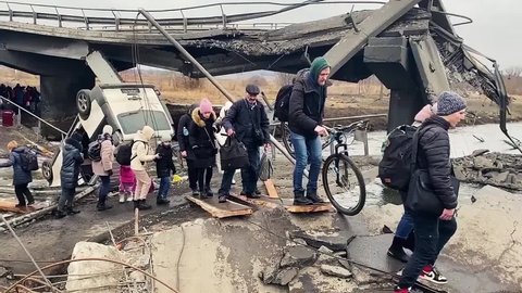 Irpen, Kyiv, Ukraine - 03.12.2022: Ukraine war. People are being evacuated from the rubble. Civilian people after the bombing.