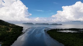 Aerial silhouette at river toward sea. Background is Pulau Aman island under blue sky day - Powered by Shutterstock - Get 15% off with code: PIKWIZARD15