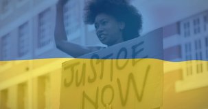 Animation of flag of ukraine over african american female protester. ukraine crisis and international politics concept digitally generated video.