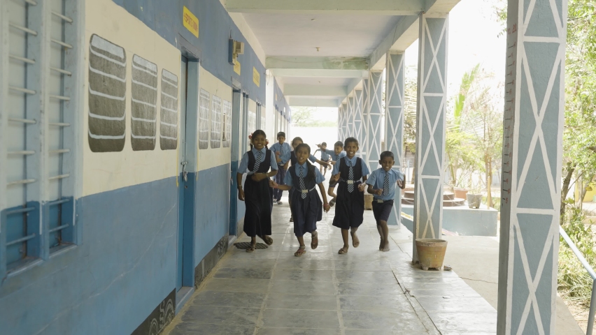 Cheerful students running at school corridor for going to classroom - concept of education, childhood excitement and knowledge | Shutterstock HD Video #1088607031