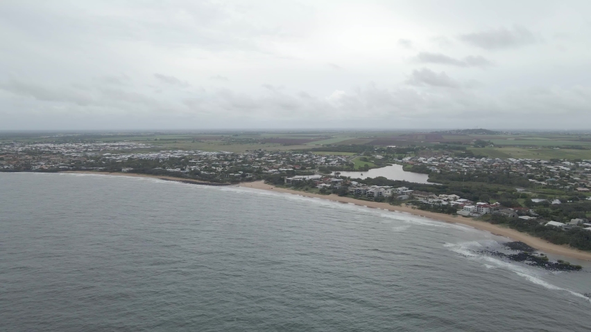 Aerial View Of Coastal Beach Town Of Bundaberg In Queensland, Australia On A Cloudy Day - drone shot