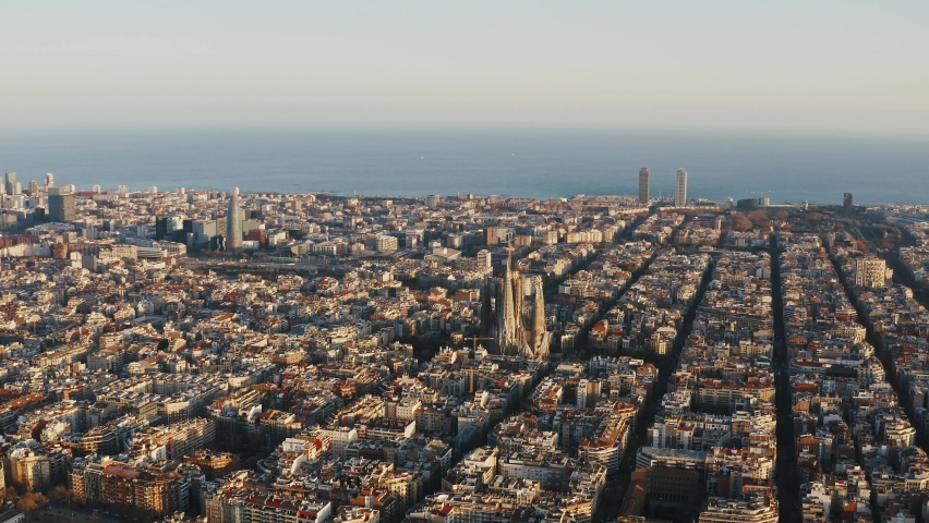 Aerial panoramic view on central part of Barselona. World famous places and points of interest Sagrada Familia, Torre Agbar, Hotel Arts, Torre Mapfre are seeing amidst residential and business areas