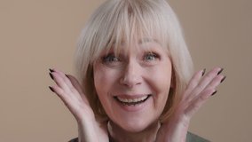Portrait 60s surprised woman looks amazed looking at camera shock emotion wonder discounts win winner victory say wow good news caucasian elderly lady old skin middle aged shoked emotional female face - Powered by Shutterstock - Get 15% off with code: PIKWIZARD15