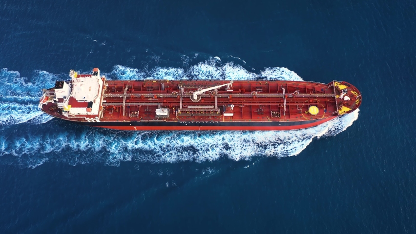 Aerial top down view of a 182 meters long oil chemical tanker ship. Supertanker loaded with full of oil, ploughs through the water. A petroleum tanker underway open sea
 Royalty-Free Stock Footage #1088616153