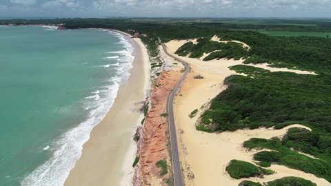 Aerial view of Cacimbinhas Beach and the coastal road RN-003, near the village of Pipa - Tibau do Sul, Rio Grande do Norte, Brazil