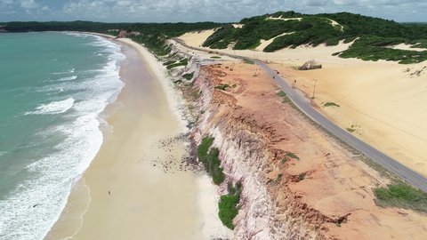 Aerial view of Cacimbinhas Beach and the coastal road RN-003, near the village of Pipa - Tibau do Sul, Rio Grande do Norte, Brazil