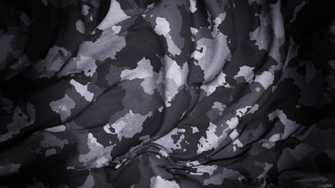Realistic slow motion 3D animation of the dark camouflage pattern cotton cloth as fly away opener rendered in UHD with alpha matte