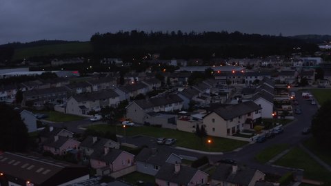 Residential borough on town outskirts. Dim streets in town after sunset. Streets at dusk. Killarney, Ireland