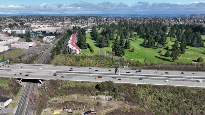 Cinematic 4K drone trucking shot of the Allenmore Golf Course near the I-5 WA-16 freeway interchange in Tacoma, Pierce County Washington