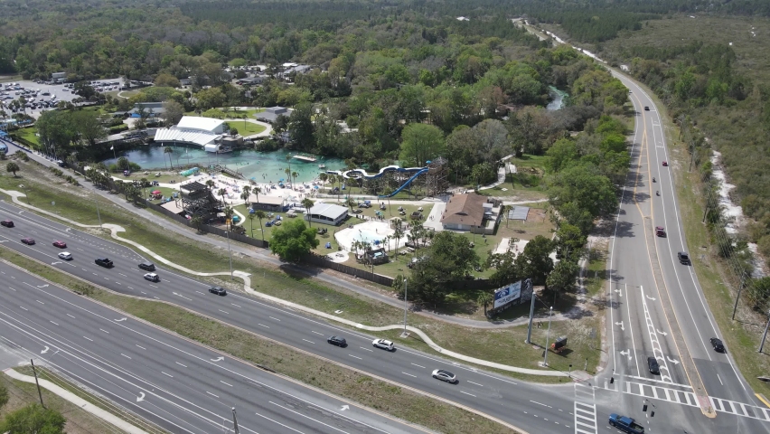 An aerial orbit of Weeki Wachee Springs State Park and the tourist attractions in Florida. Generations of family fun