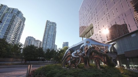 Vancouver , British Columbia , Canada - 03 22 2022: Stainless steel panda sculpture in front of JW Marriot Parq Vancouver Hotel