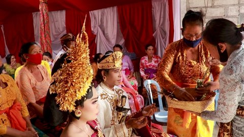 Bali, Indonesia, 8 March, 2022. Wedding couple on a traditional balinese wedding ceremony in Bali