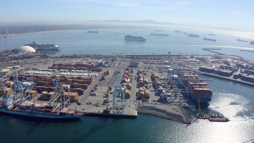 Cargo containers in busy port, aerial. Drone shot. Shipping harbor, logistics. Drone Flight Over Busy Container Yard. 4K Aerial view of Industrial port with containers ship. big cargo port.  Royalty-Free Stock Footage #1088627467