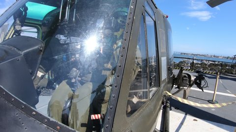 San Diego, California, United States - JULY 2018: UH-1 Huey Gunship helicopter of 1960s. USS Midway Battleship museum. American helicopter served in Vietnam War.
