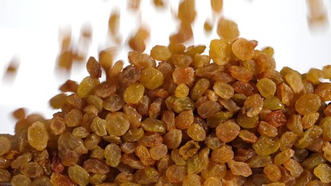 raisins fall in slow motion and cover the whole screen