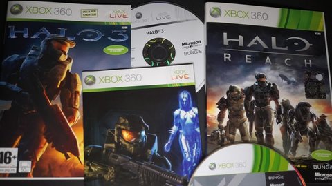 Rome, Italy - March 26, 2022, detail of the covers and DVDs of the game Halo 3 and Halo Reach for Xbox 360.