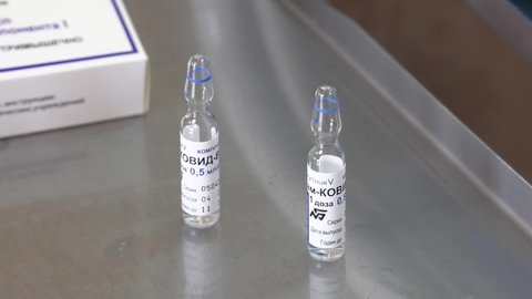 Russia.Bryansk. 03.03.2022:A Sputnik V and Sputnik Light vials vaccine bottles with injection Syringes of Russian covid-19 immunization vaccines.