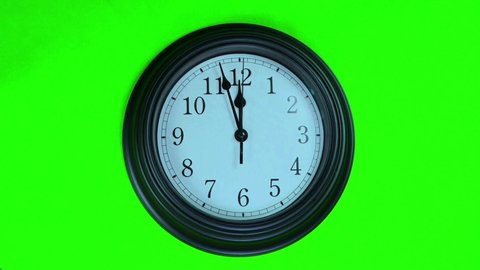 One minute footage of a wall clock with green screen.